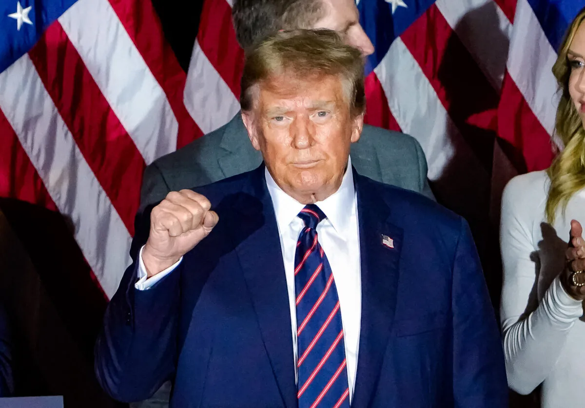 Republican presidential hopeful and former President Donald Trump celebrates his victory at a primary election night party in Nashua, N.H., on Jan. 23, 2024. (Timothy A. Clary/AFP via Getty Images)