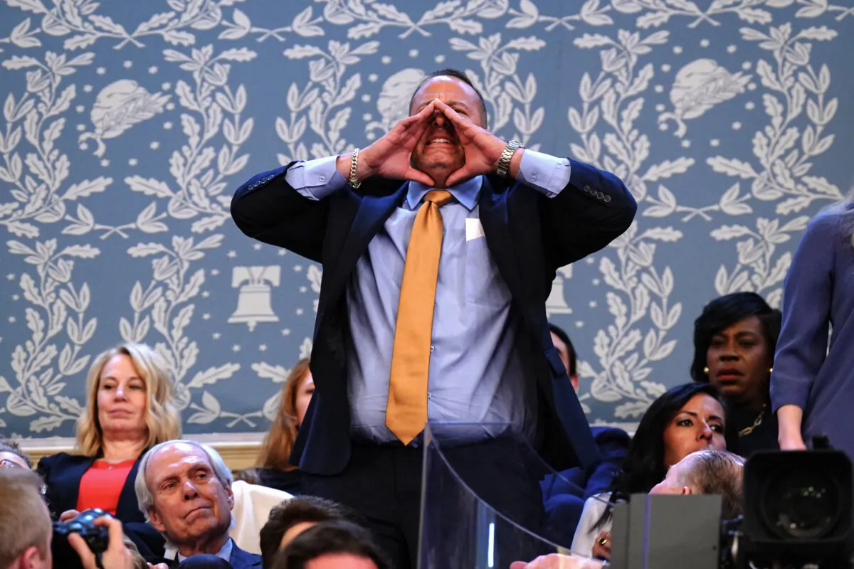 Steven Nikoui shouts as President Joe Biden delivers his State of the Union address at the U.S. Capitol in Washington on March 7, 2024. (Shawn Thew/POOL/AFP via Getty Images)