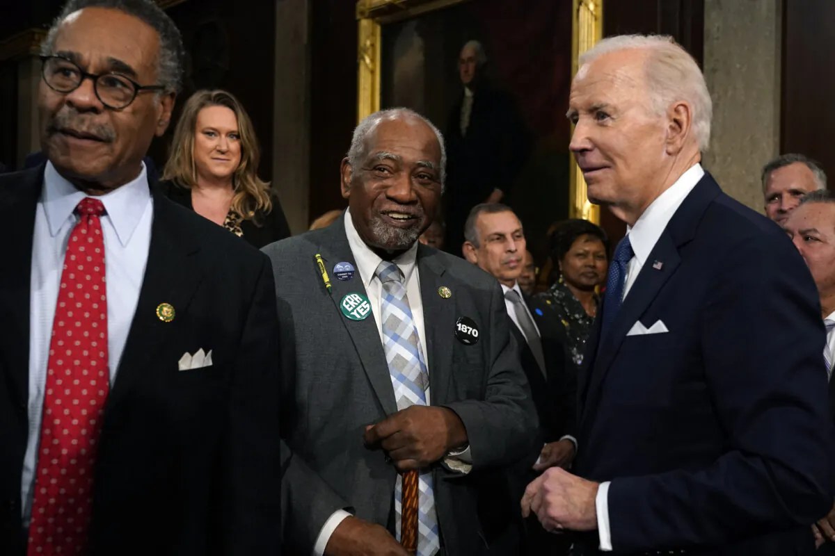President Joe Biden talks with Rep. Danny Davis (D-Ill.), as Emanuel Cleaver (D-Mo.) watches after the State of the Union address in the House Chamber of the U.S. Capitol in Washington on Feb. 7, 2023. (Jacquelyn Martin /AFP via Getty Images)