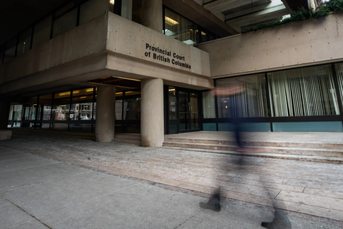 A person walks past the Provincial Court of British Columbia in Vancouver, B.C., on Jan. 16, 2024. (The Canadian Press/Ethan Cairns)