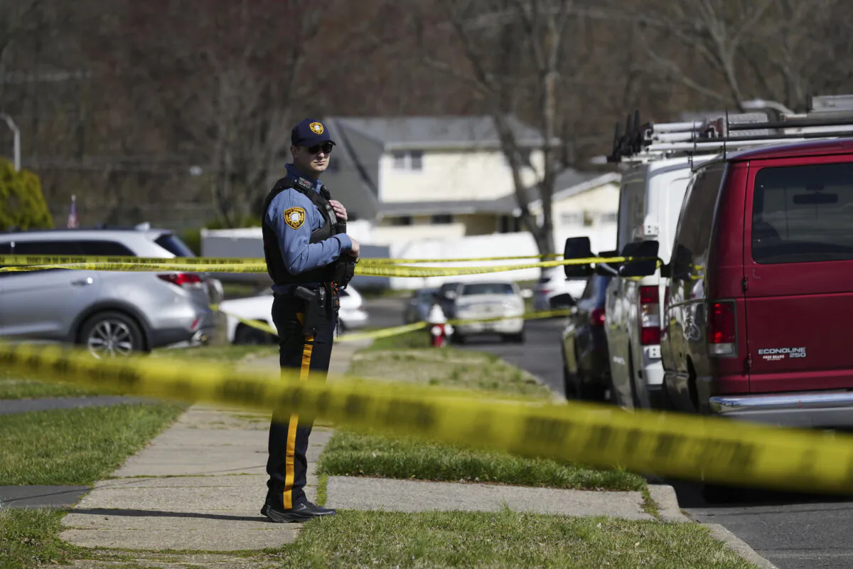 Police respond to a neighborhood after a shooting in Levittown, Pa., on March 16, 2024. (Matt Rourke/AP Photo)