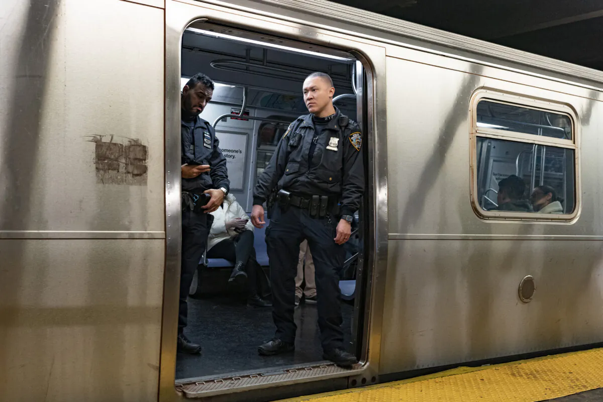 NYPD officers stand aboard a train at the West Fourth Street subway station, in New York, on Jan. 13, 2024. (Peter K. Afriyie/AP Photo, File)
