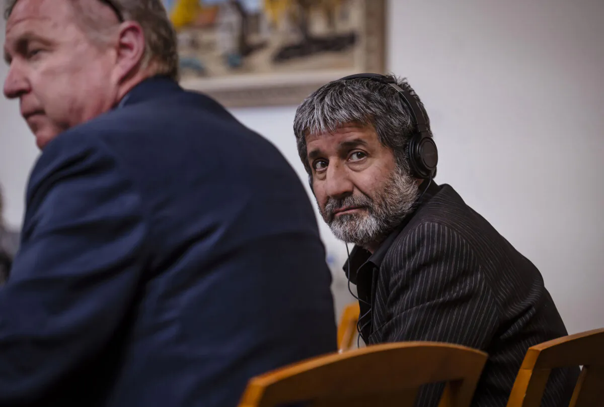 Muhammad Syed sits next to his defense attorney Thomas Clark, left, during closing arguments at the Bernalillo County Courthouse in Downtown Albuquerque, N.M., on March 15, 2024. (Chancey Bush/The Albuquerque Journal via AP, Pool)