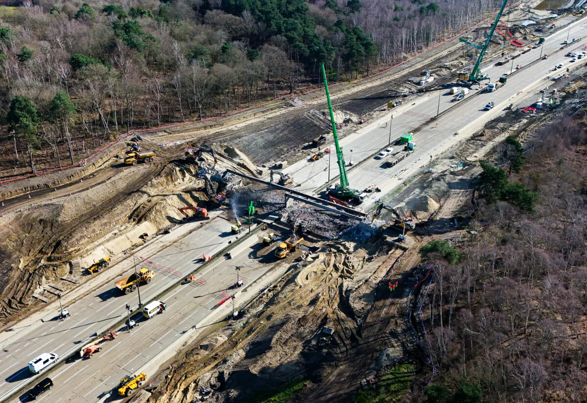 Before installation of a new gantry, a bridge is demolished in Surrey, England on 17 March 2024.(Yui Mok/PA)