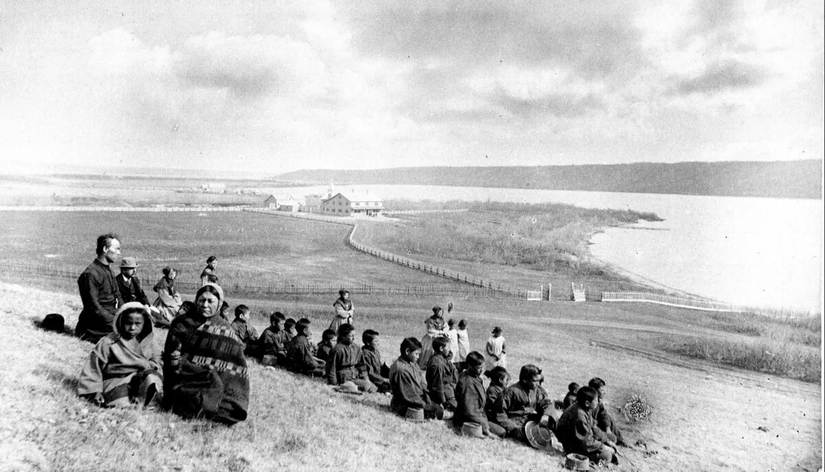 Aboriginal students, principal Father Joseph Hugonnard, and staff, including the Grey Nuns, of the residential school are shown in Fort Qu'Appelle, Saskatchewan in this May 1885 file photo. (The Canadian Press/National Archives of Canada/O.B. Buell, PA-118765)