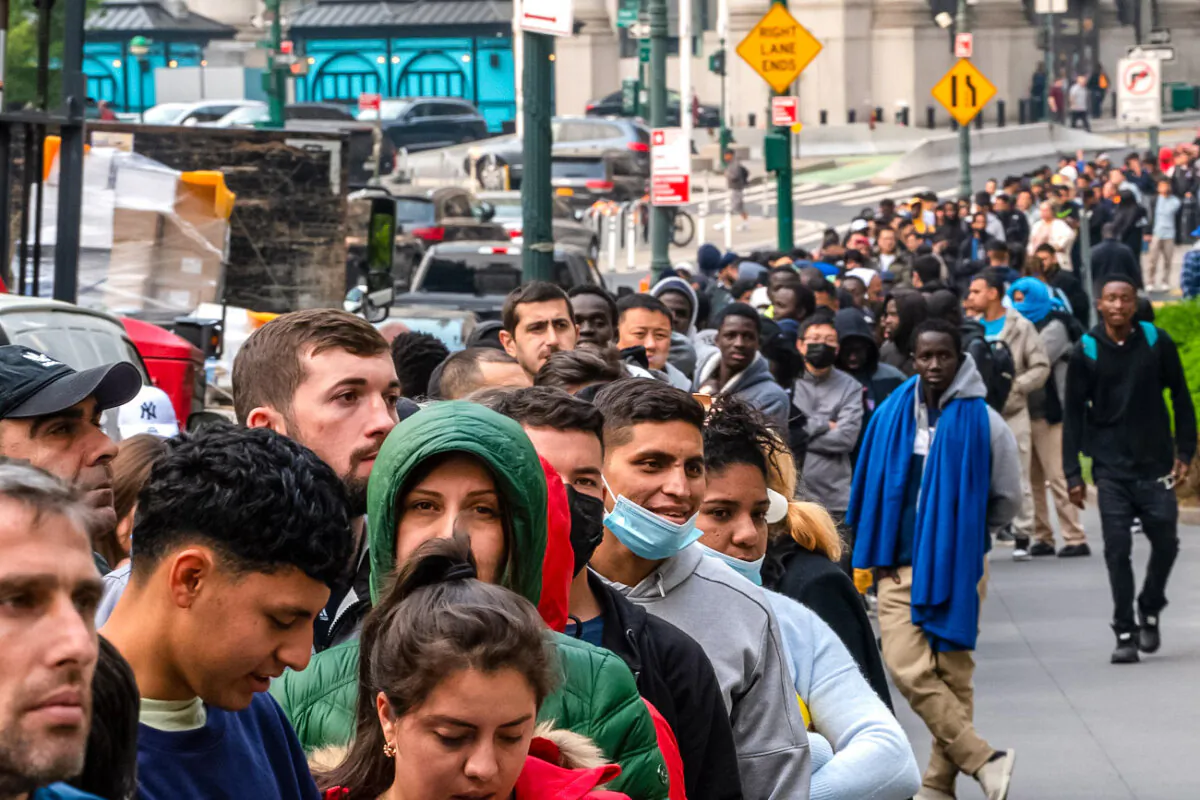 Hundreds of illegal immigrants line up outside of the Jacob K. Javits Federal Building in New York City on June 6, 2023. (David Dee Delgado/Getty Images)
