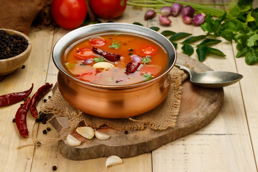Rasam's tang and spice is balanced against the savory undertones of lentil water. (AALA IMAGES/Shutterstock)