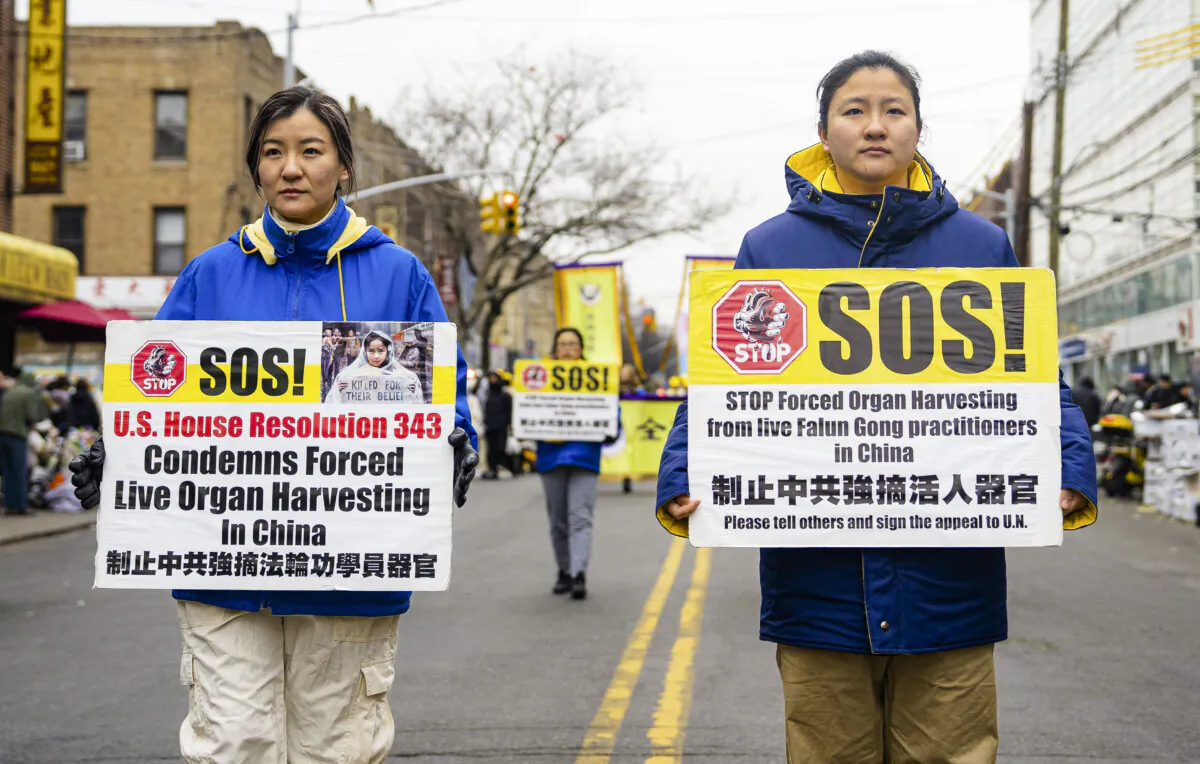 Falun Gong practitioners walk in a parade in Brooklyn, N.Y., highlighting the Chinese regime's persecution of their faith on Feb. 26, 2023. (Chung I Ho/The Epoch Times)