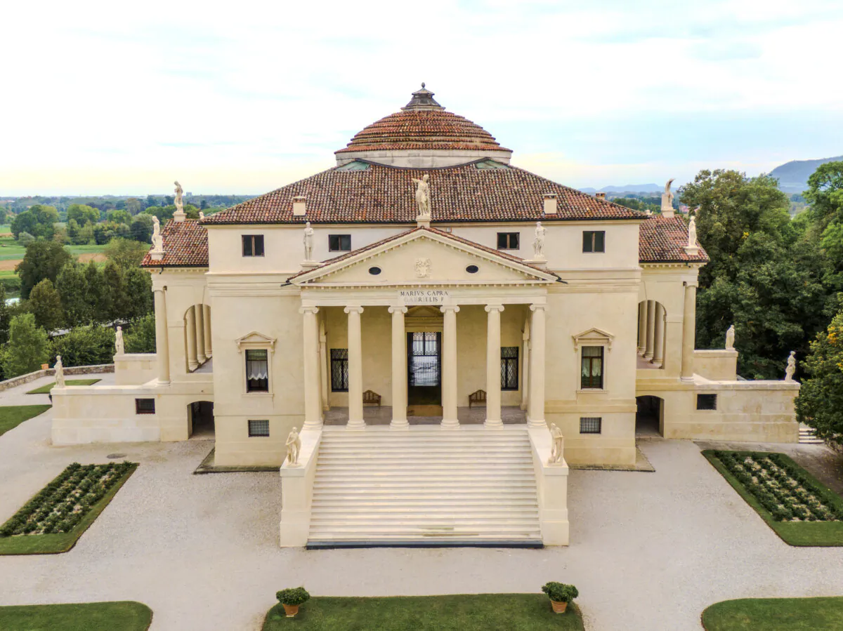 The entrance of the grand Renaissance villa resembles that of a Roman temple. Six tall Ionic columns, a triangular pediment, and elongated portico window openings accentuate the vertical thrust of the villa and give the composition a bold presence. (J.H. Smith)