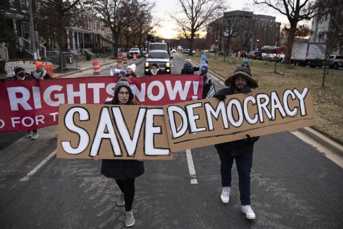 Activists rally for voting rights and DC statehood as they block traffic on Pennsylvania Avenue SE in Washington on Dec. 7, 2021. (Drew Angerer/Getty Images)