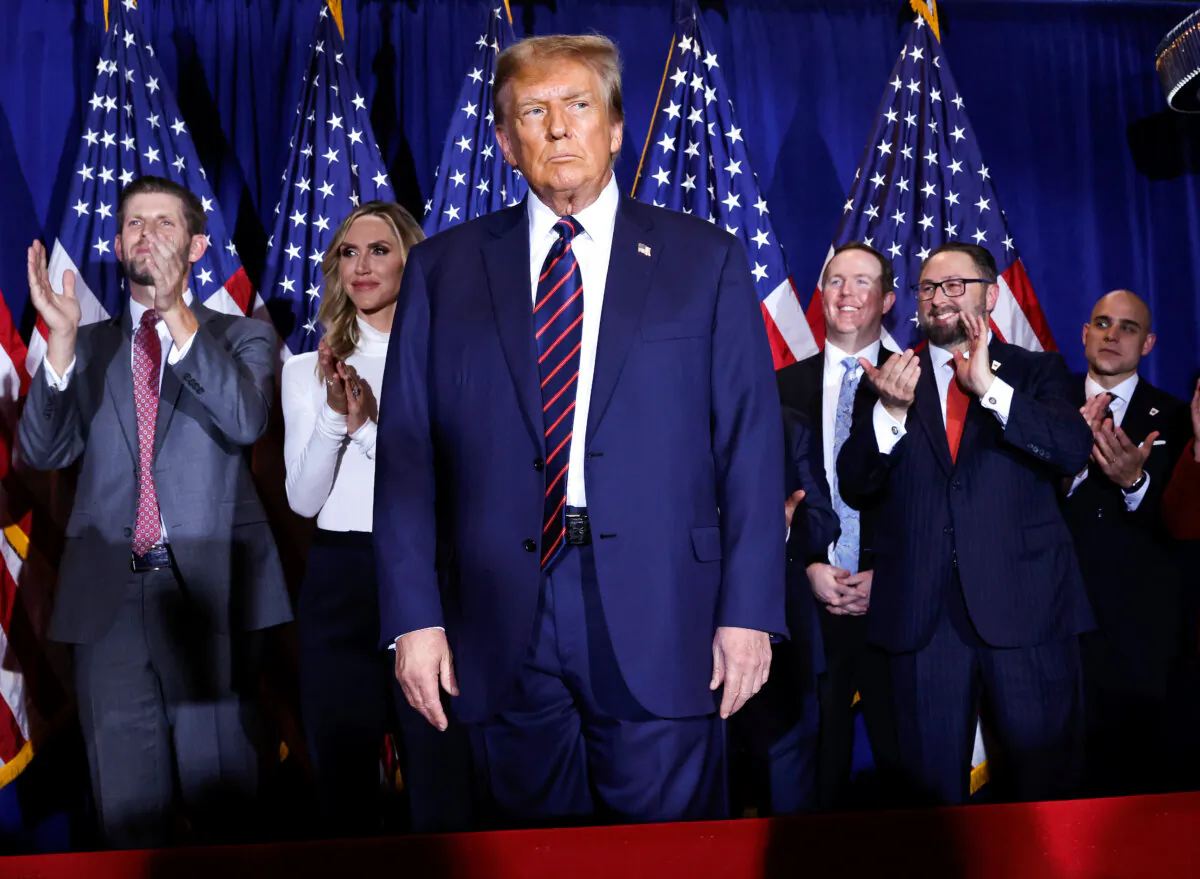 Republican presidential candidate and former U.S. President Donald Trump takes the stage with supporters, campaign staff, and family members for a primary night party at the Sheraton in Nashua, N.H., on Jan. 23, 2024. (Chip Somodevilla/Getty Images)