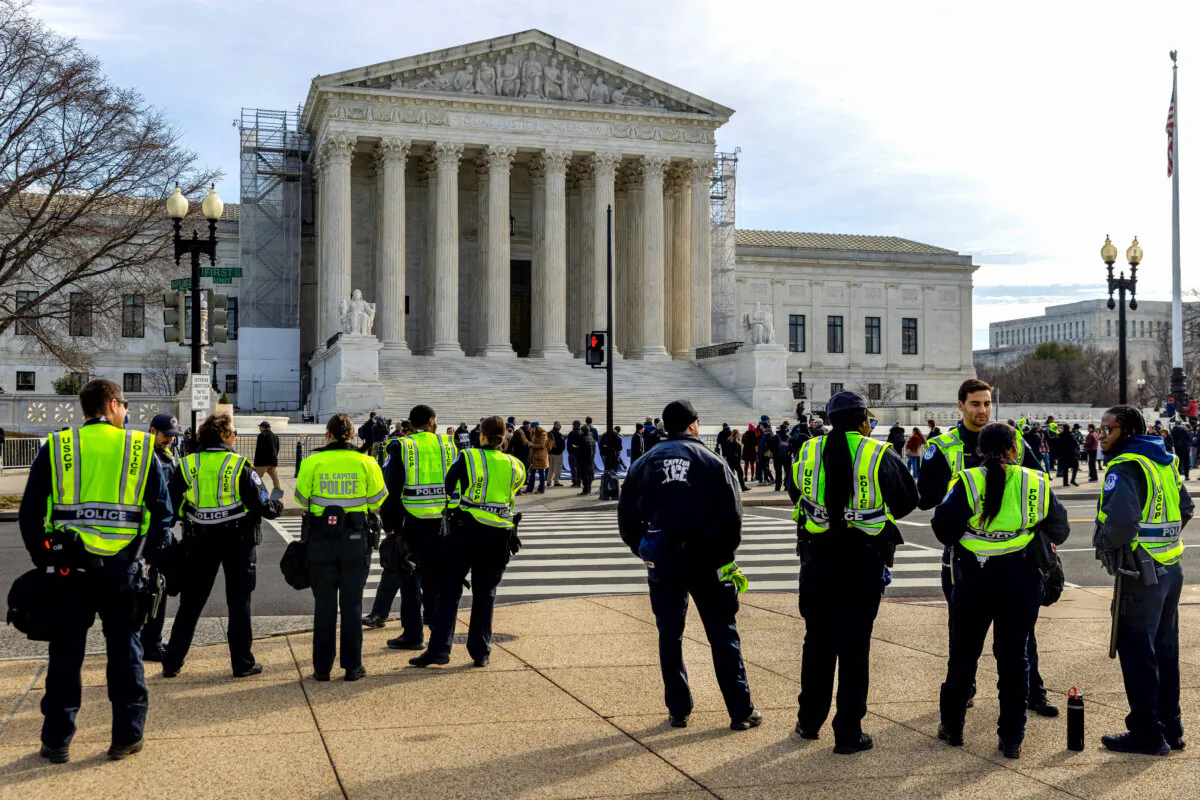 Police officers stand outside the Supreme Court in Washington on Feb. 8, 2024. (Julia Nikhinson/Getty Images)
