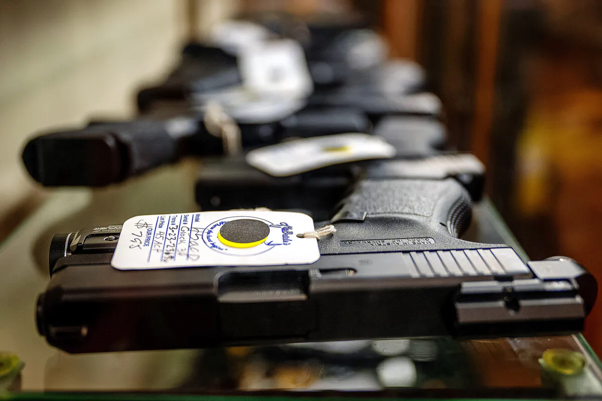 Semi-automatic firearms are displayed for sale in a store in a file image. (Brandon Bell/Getty Images)