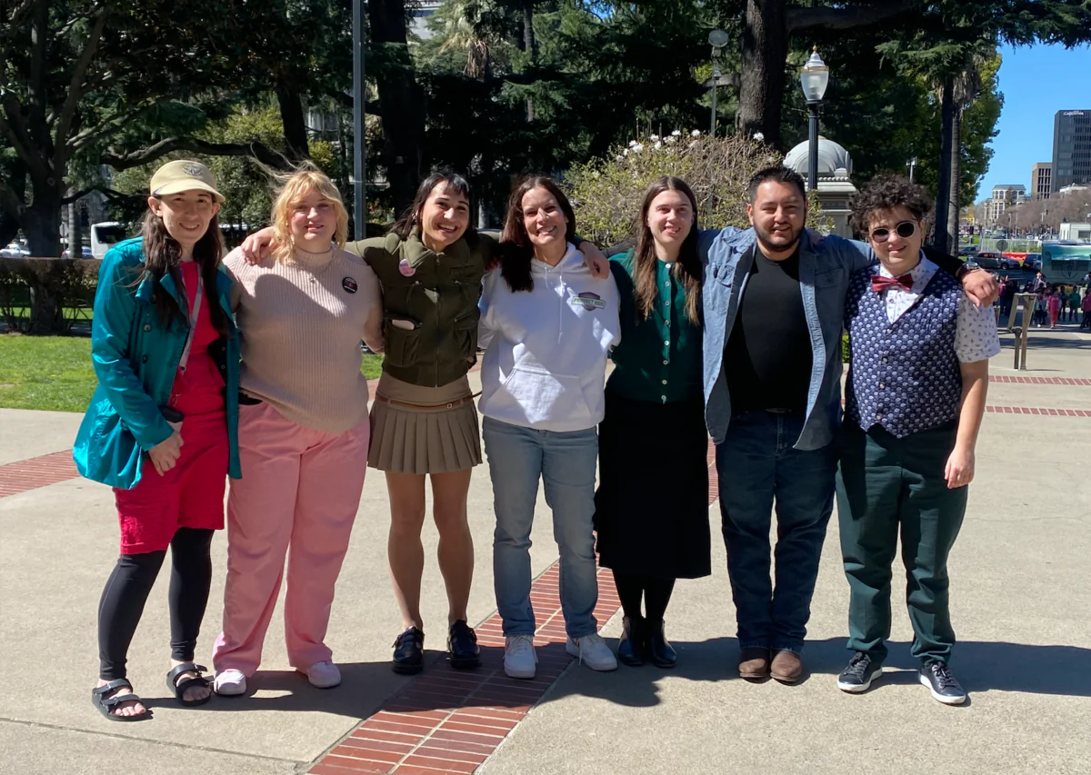 Attorney Erin Friday (C) with detransitioners at the Detrans Awareness rally in Sacramento, Calif., on March 14, 2024. (Courtesy of Protect Kids California)