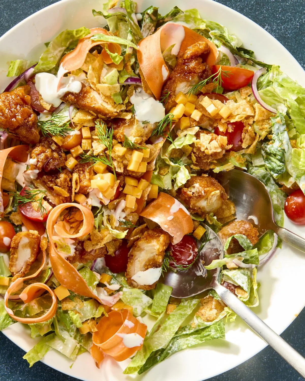 The best way to eat Buffalo glazed chicken? On this salad. (Alex Lepe/TNS)