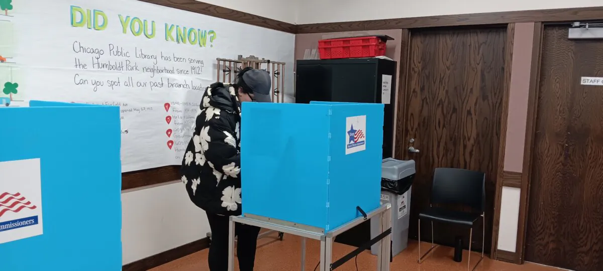 A voter at a voting location at the Humboldt Park Branch of the Chicago Public Library in Chicago, Ill., on March 19, 2024. (Nathan Worcester/The Epoch Times)