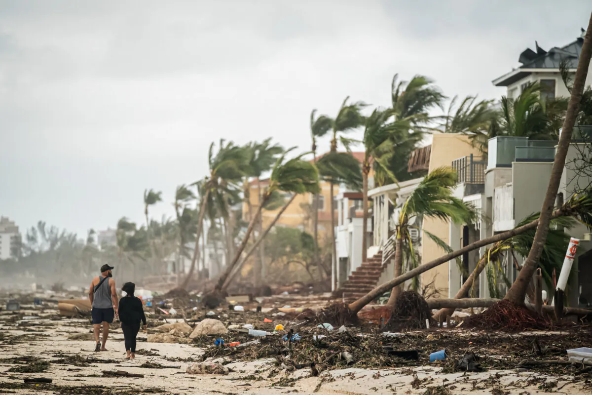 People eye the damage after Hurricane Ian in Bonita Springs, Fla., on Sept. 29, 2022. (Sean Rayford/Getty Images)