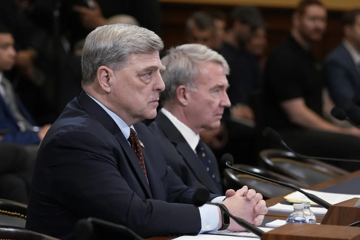Retired Gen. Mark Milley (L), the former chairman of the Joint Chiefs of Staff, and retired Gen. Kenneth McKenzie, former commander of the U.S. Central Command, speak to the House Foreign Affairs Committee about the U.S. withdrawal from Afghanistan, at the Capitol in Washington on March 19, 2024. (J. Scott Applewhite/AP Photo)