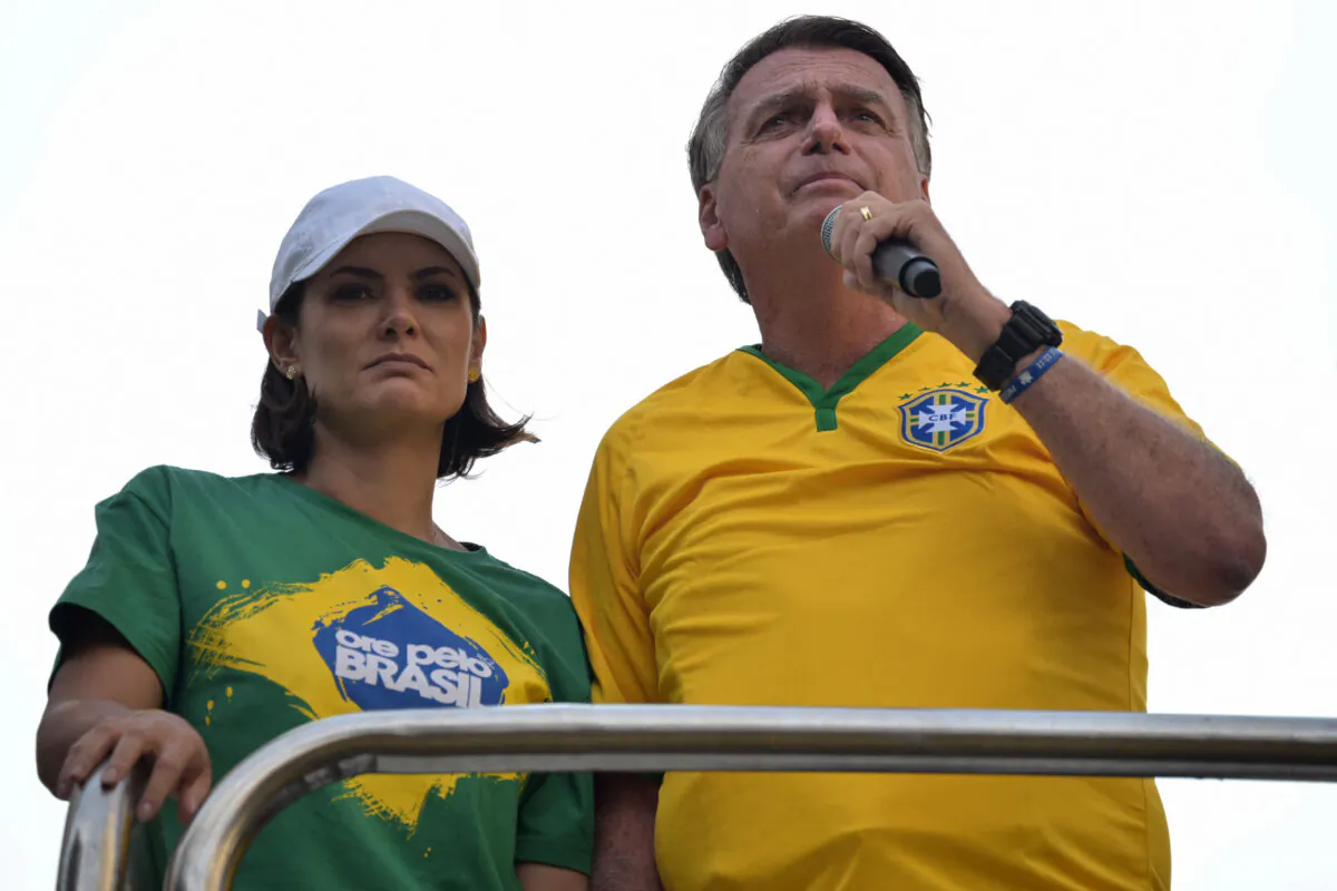 Former Brazilian President Jair Bolsonaro (R) speaks to supporters next to his wife, Michelle Bolsonaro, during a rally in Sao Paulo, Brazil, on Feb. 25, 2024. (Nelson Almeida/AFP via Getty Images)