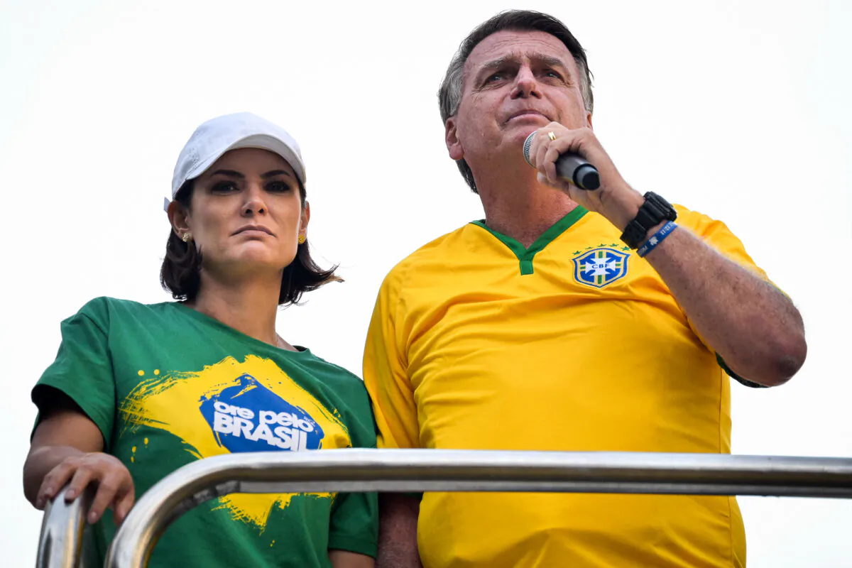 Former Brazilian President Jair Bolsonaro (R) speaks to supporters next to his wife Michelle Bolsonaro during a rally in Sao Paulo, Brazil, on Feb. 25, 2024. (Nelson Almeida/AFP via Getty Images)