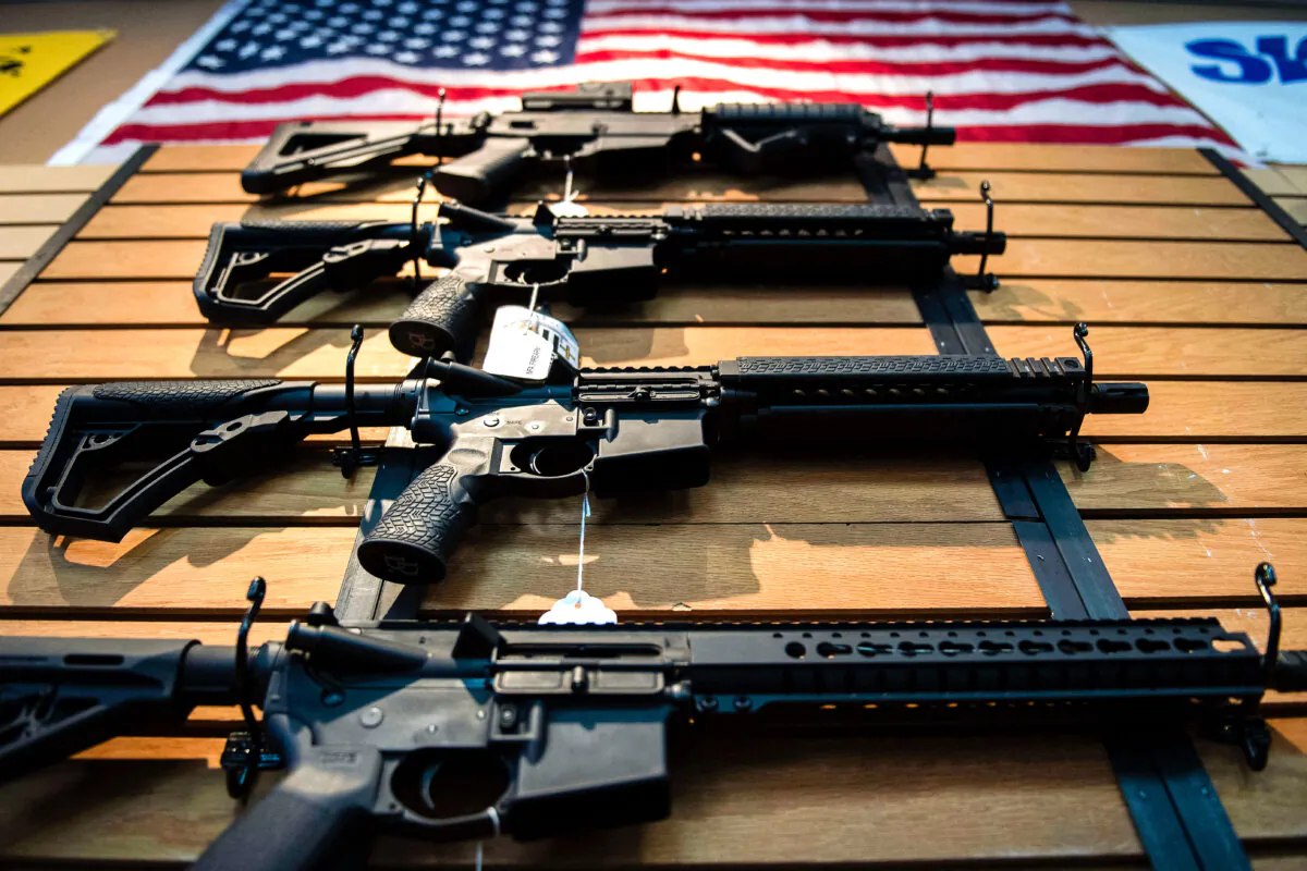 Semi-automatic rifles hang on the wall for sale at Blue Ridge Arsenal in Chantilly, Virginia, on Oct. 6, 2017. (JIM WATSON/AFP via Getty Images)