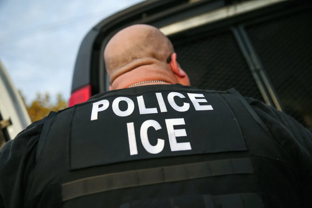An Immigration and Customs Enforcement agent detains an illegal immigrant in a file photo. (John Moore/Getty Images)