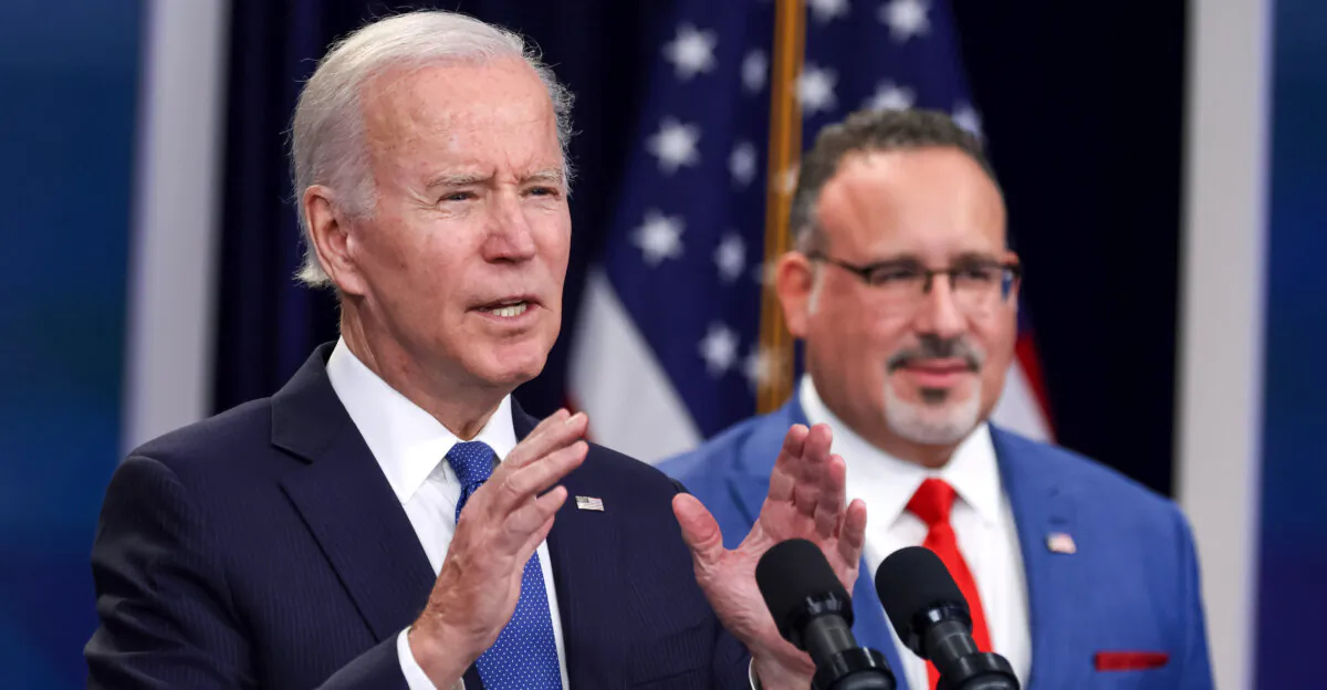 President Joe Biden speaks on a previous student debt relief plan as Education Secretary Miguel Cardona looks on in Washington on Oct. 17, 2022. (Alex Wong/ Getty Images)