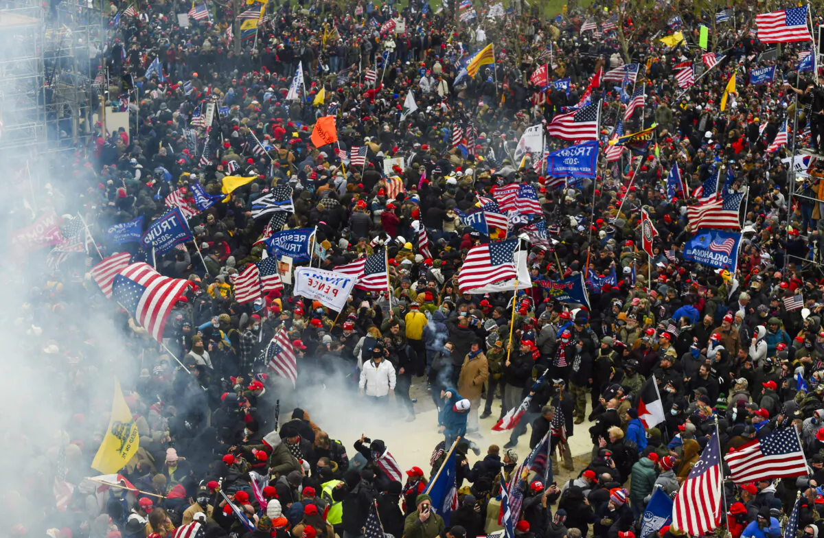 Tear gas blows through the crowd of protesters on the west plaza of the U.S. Capitol on Jan. 6, 2021. (Roberto Schmidt/AFP via Getty Images)