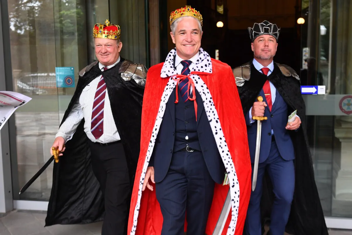 Shane Knuth, Robbie Katter, KAP Leader and Member for Traeger, and Nick Dametto arrive to speak to the media about the importance of cash at Queensland Parliament in Brisbane, Australia on March 20, 2024. (AAP Image/Jono Searle) 