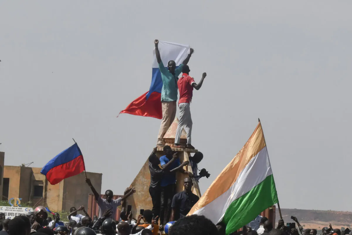 Protesters wave Nigerien and Russian flags as they gather during a rally in support of Niger's junta in Niamey on July 30, 2023. (AFP via Getty Images)