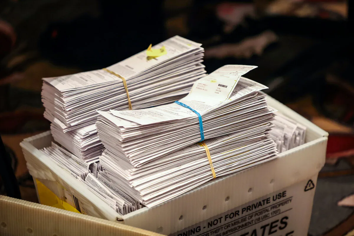 Election ballots stacked in a box as workers count mail-in and in-person absentee ballots at the Wisconsin Center in Milwaukee on Nov. 8, 2022. (Scott Olson/Getty Images)