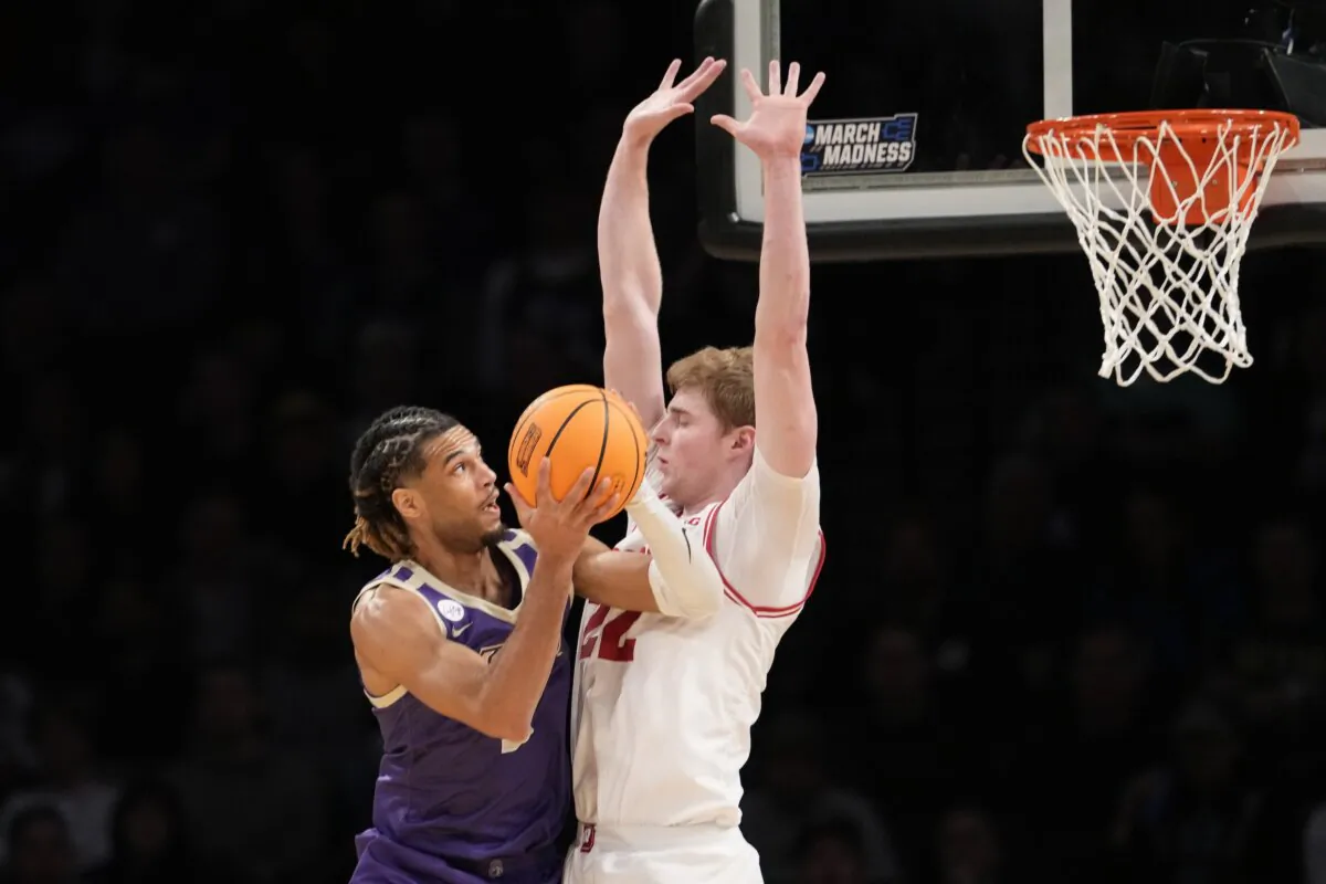 James Madison forward T.J. Bickerstaff (L) goes to the basket against Wisconsin forward Steven Crowl (22) during the first half of a first-round college basketball game in the men's NCAA Tournament in New York on March 22, 2024. (Mary Altaffer/AP Photo)