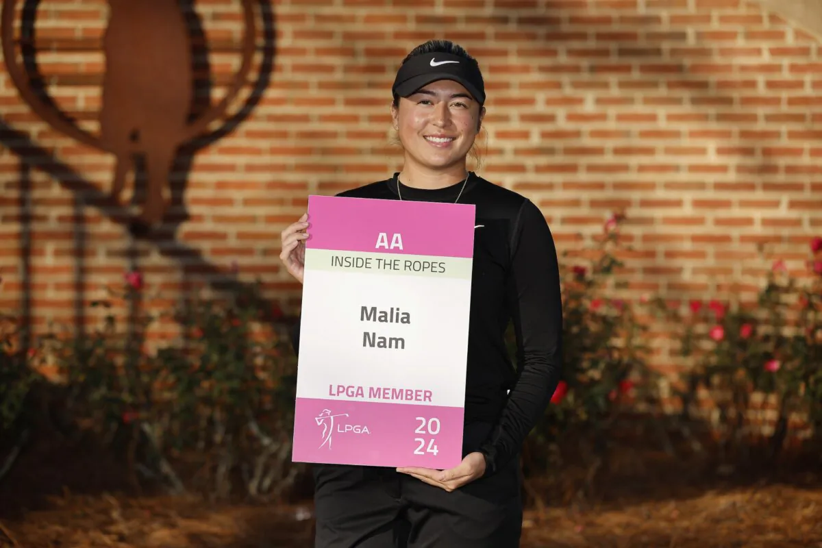 Malia Nam of the United States poses with the tour card after the sixth round of LPGA Q-School at Magnolia Grove Golf Course in Mobile, Ala., on Dec. 6, 2023. (Alex Slitz/Getty Images)