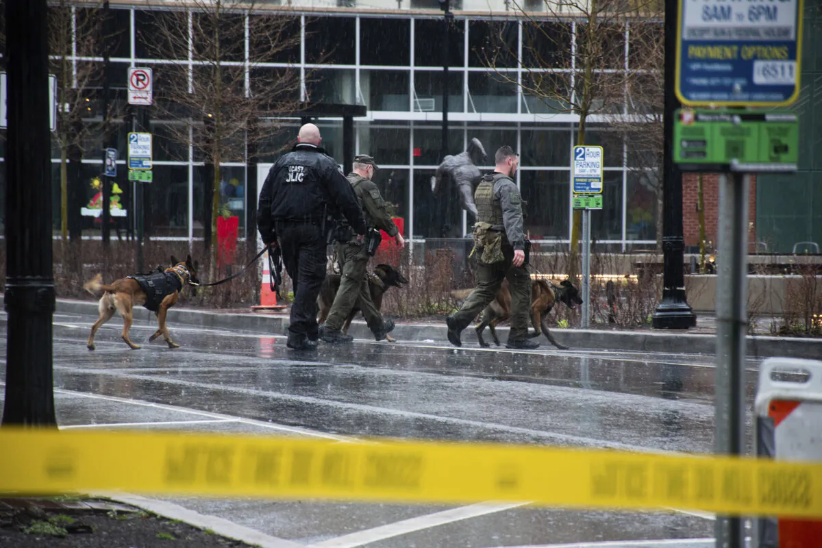 Police K-9's patrol around the blocked off 100 block of Queen Street in Lancaster City, Pa., on March 23, 2024. (Amber Ritson/LNP/LancasterOnline via AP)