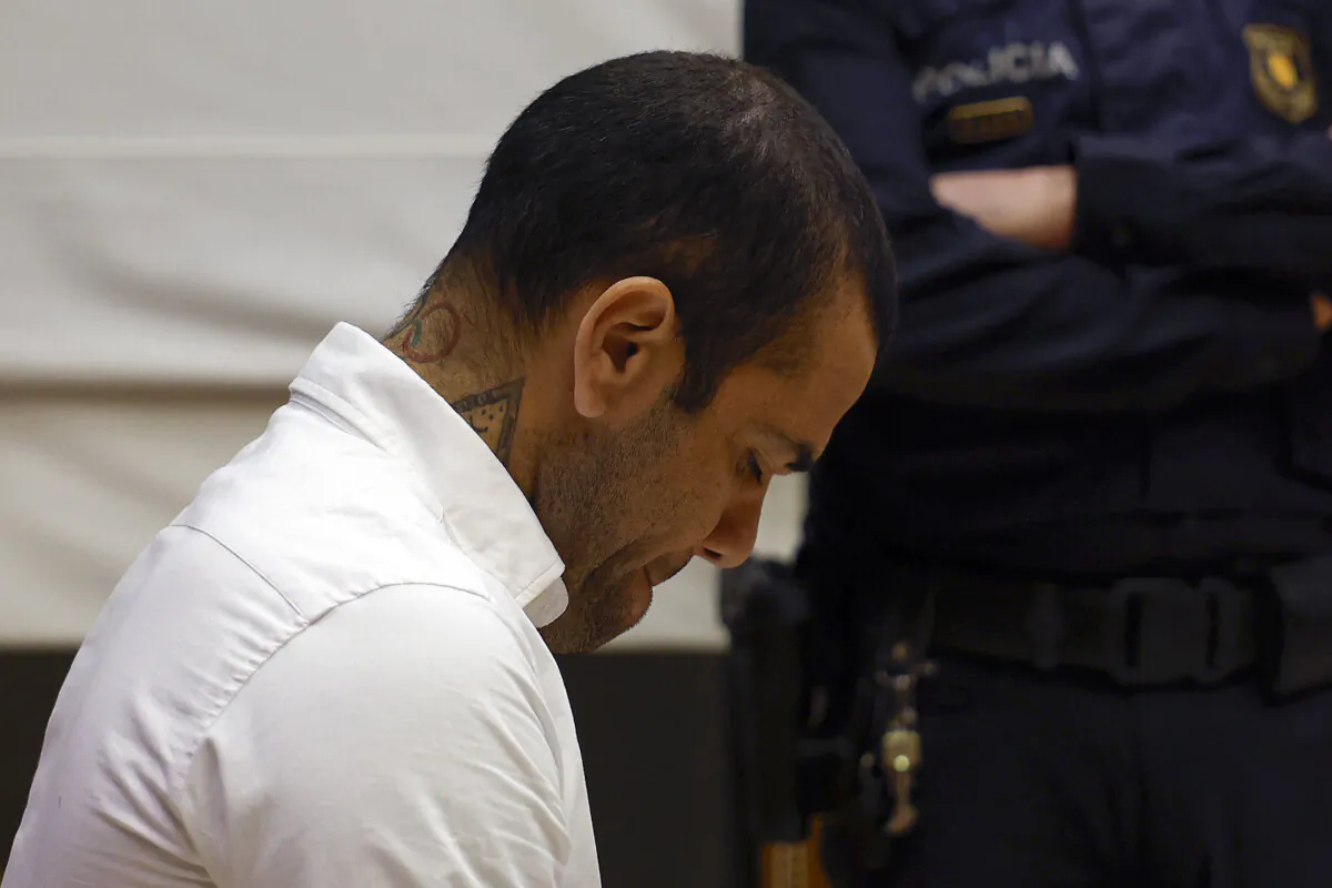 Brazilian footballer Dani Alves looks down during his trial at the High Court of Justice of Catalonia in Barcelona on Feb. 5, 2024. (Alberto Estévez/Pool/AFP via Getty Images)