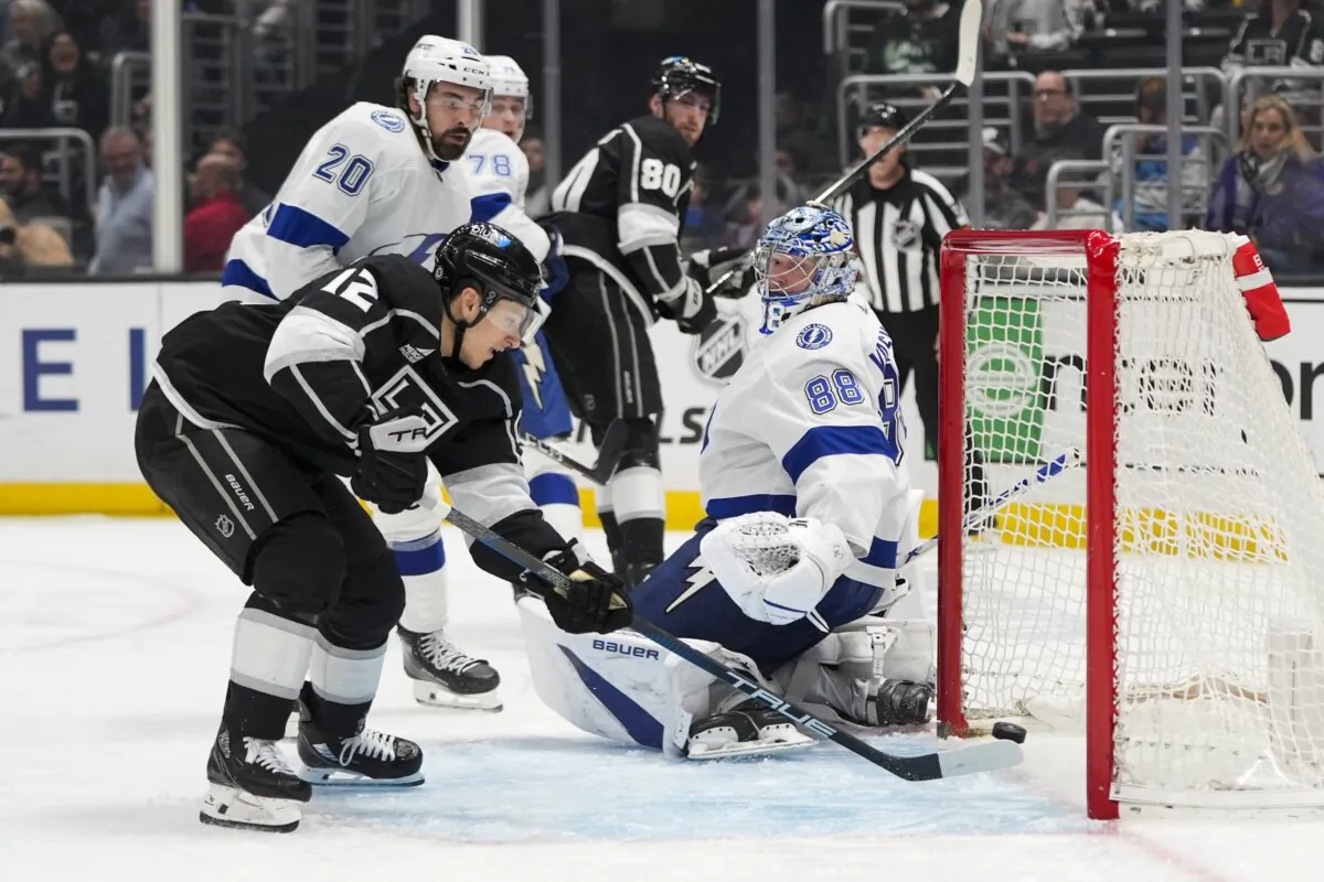 Los Angeles Kings' Trevor Moore (12) scores against Tampa Bay Lightning goaltender Andrei Vasilevskiy (88) during the second period of an NHL hockey game in Los Angeles on March 23, 2024. (Jae C. Hong/AP Photo)