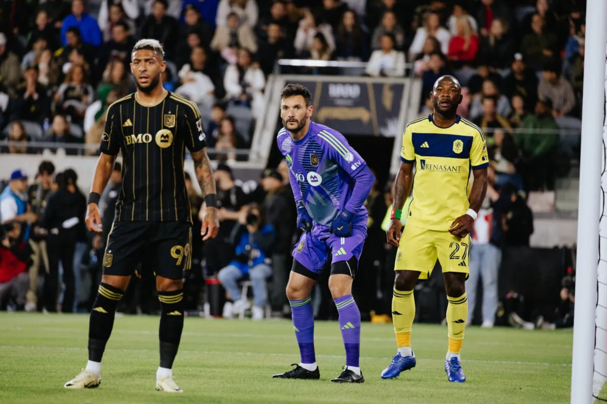 LAFC forward Denis Bouanga (99) and goalkeeper Hugo Lloris (1) prepare to defend a corner kick against Nashville SC midfielder, Brian Anunga (27), in Los Angeles on March 23, 2024. (Courtesy of LAFC via The Epoch Times)