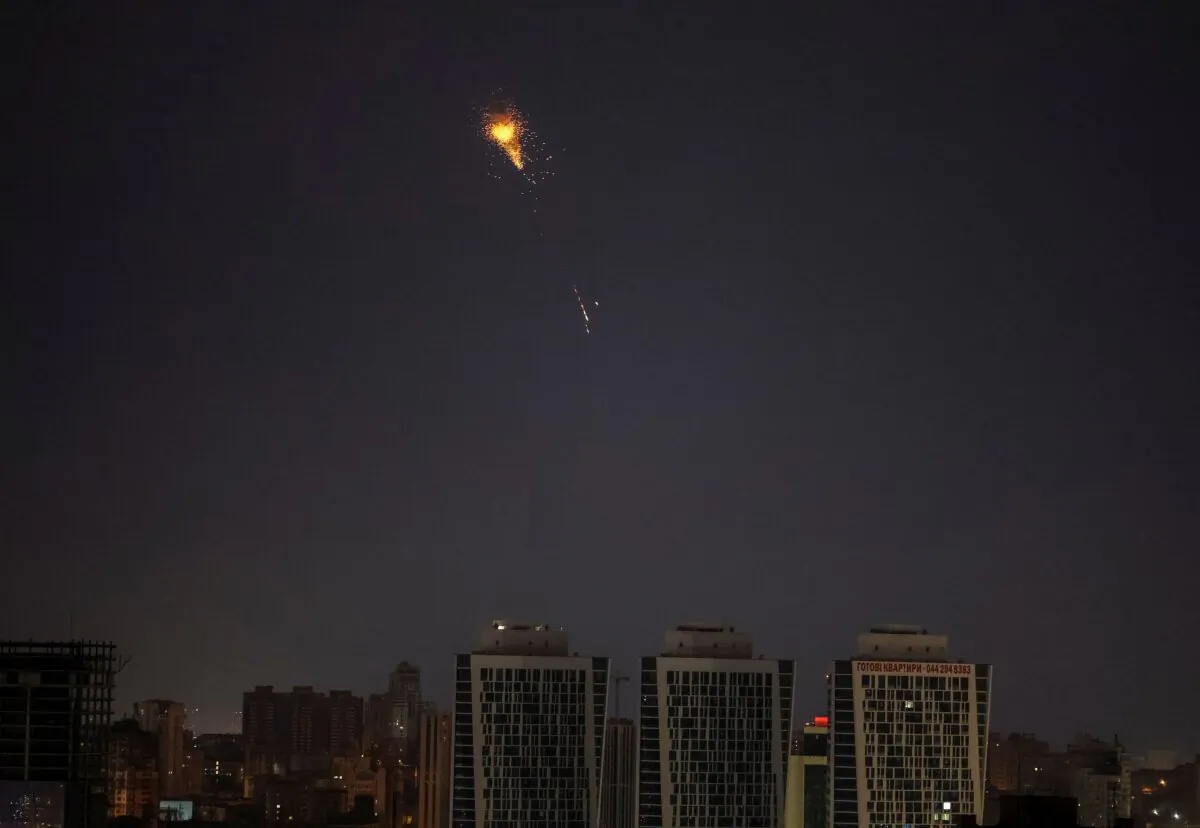 An explosion of a missile in the sky over the city during a Russian missile strike in Kyiv, Ukraine, on March 24, 2024. (Gleb Garanich/Reuters)