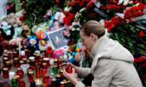 Russians Lower Flags in Mourning, Suspects Charged in Deadly Concert Hall Attack