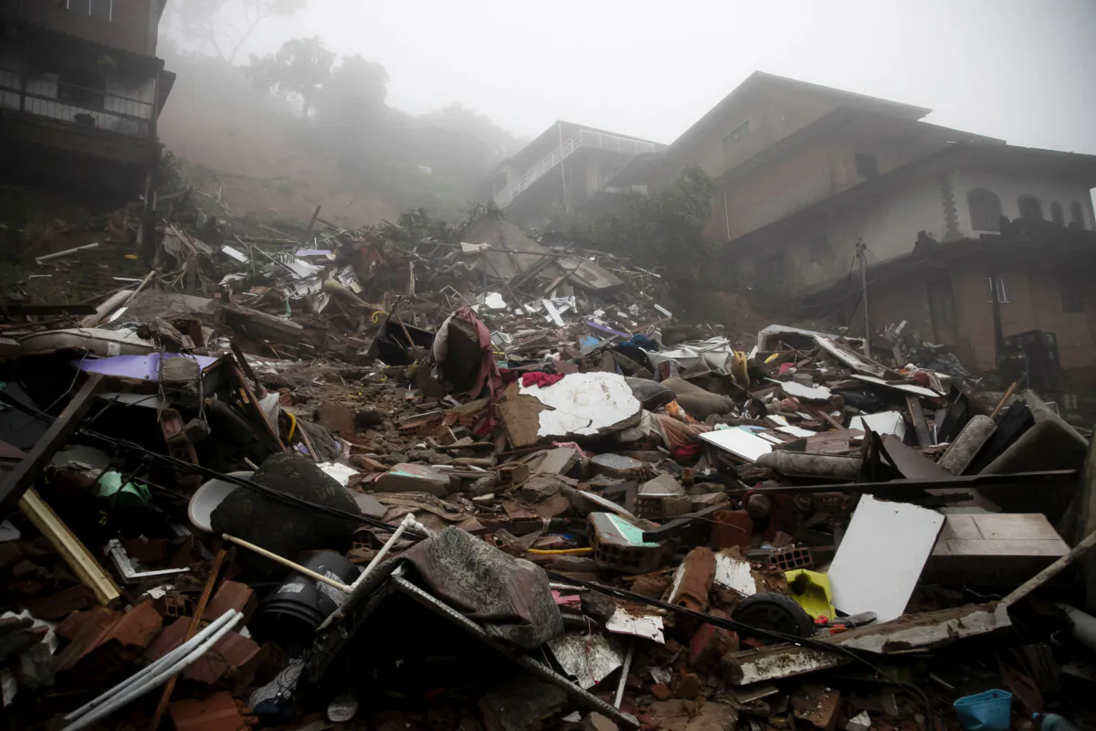 Debris from homes destroyed by a landslide caused by heavy rains in Petropolis, Rio de Janeiro state, Brazil, on March 23, 2024. (Bruna Prado/AP Photo)