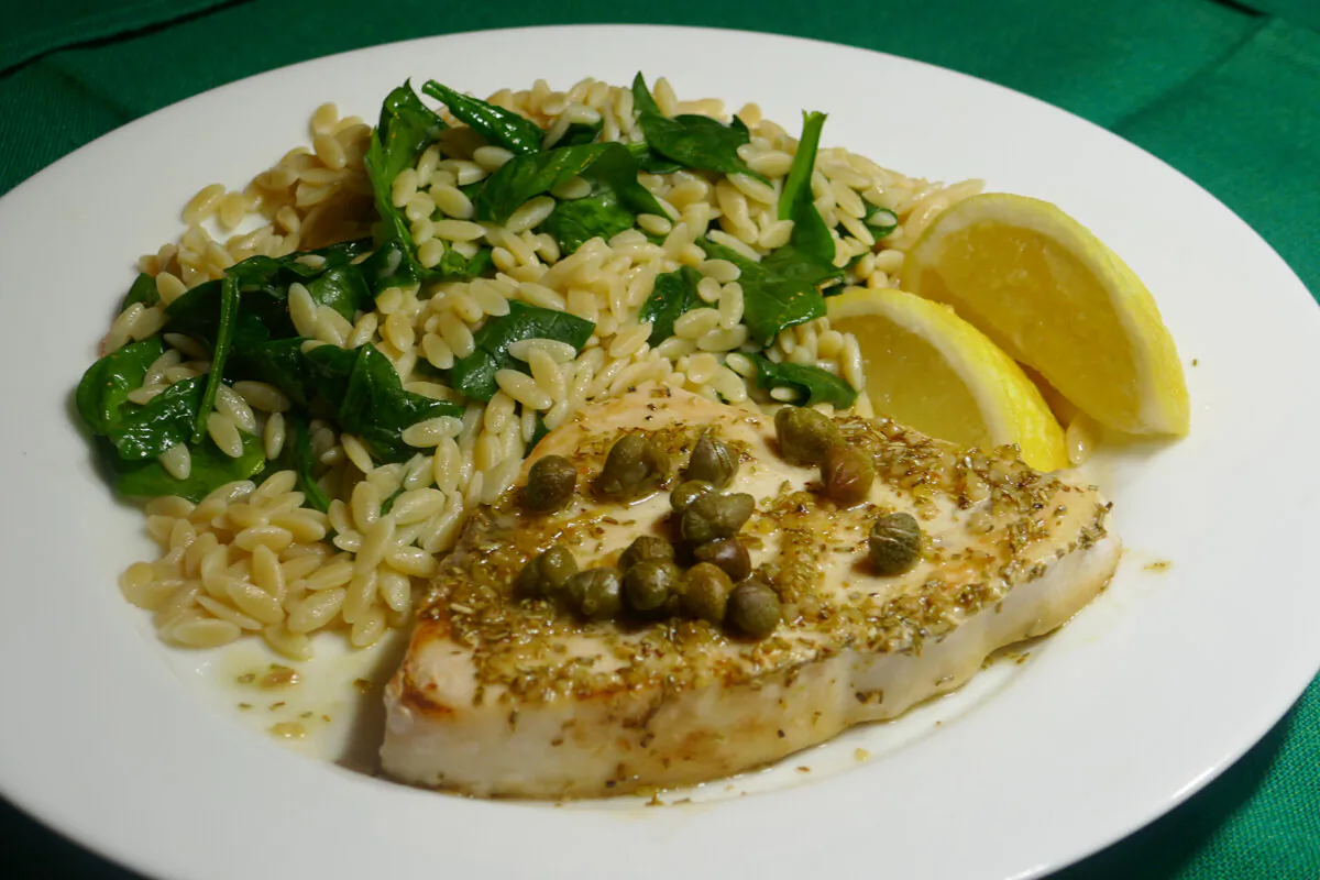 Rosemary, lemon, garlic swordfish with spinach orzo. (Linda Gassenheimer/TNS)
