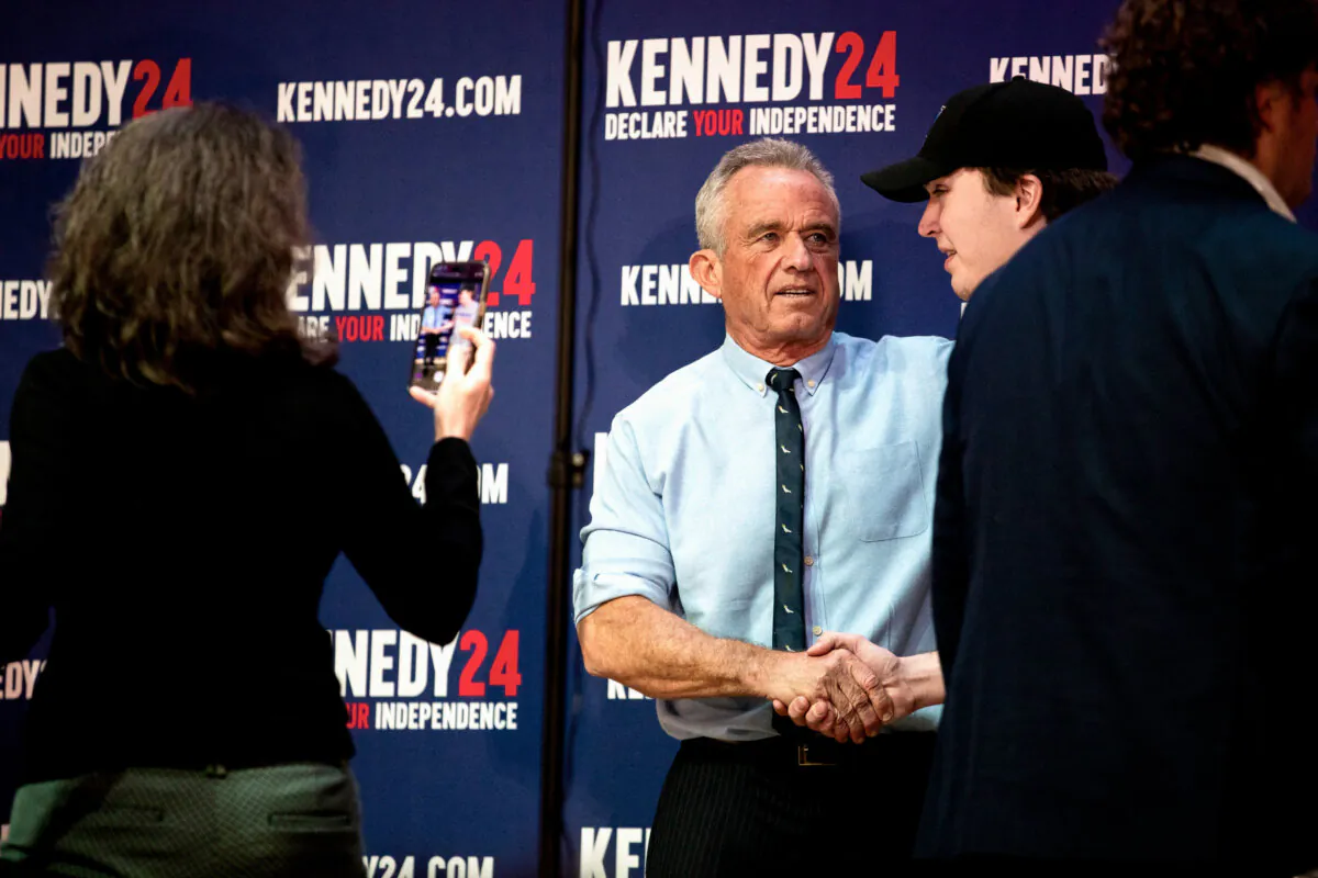 Independent presidential candidate Robert F. Kennedy Jr. poses with supporters during a meet and greet after a voter rally at St. Cecilia Music Center in Grand Rapids, Mich., on Feb. 10, 2024. (Emily Elconin/Getty Images)