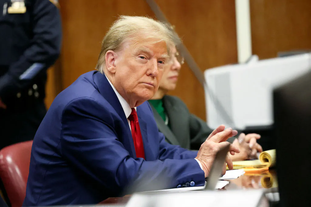 Former President Donald Trump attends a hearing to determine the date of his trial for allegedly covering up hush money payments linked to extramarital affairs, at Manhattan Criminal Court in New York City on March 25, 2024. (Brendan McDermid/Pool/AFP via Getty Images)