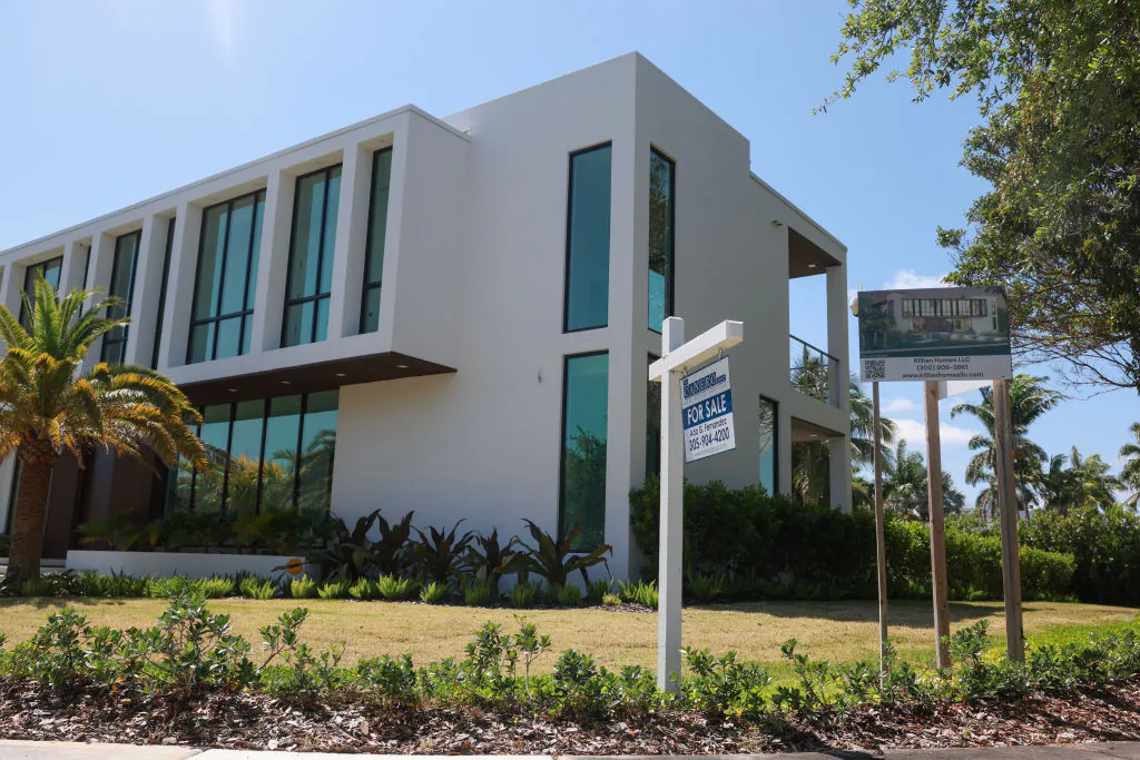 A 'For Sale' sign is posted on the lawn in front of a home in Miami on March 15, 2024. (Joe Raedle/Getty Images)