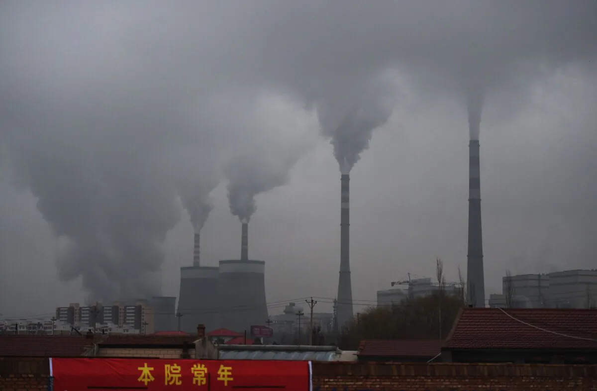 This file photo shows smoke belching from a coal-fueled power station near Datong, in China's northern Shanxi Province on Nov. 19, 2015. (Greg Baker/AFP via Getty Images)