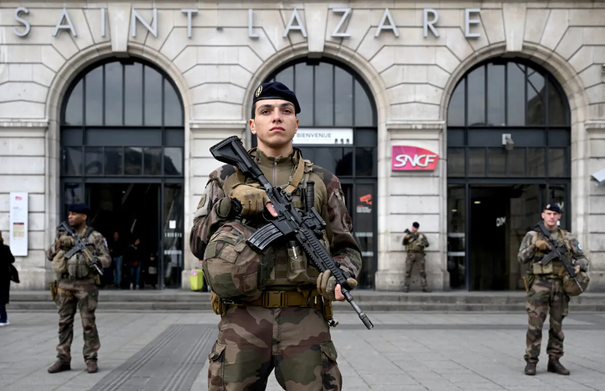 French soldiers of the Sentinelle security operation patrol in front of the Saint-Lazare railway station in Paris on March 25, 2024. (Bertrand Guay/AFP via Getty Images)