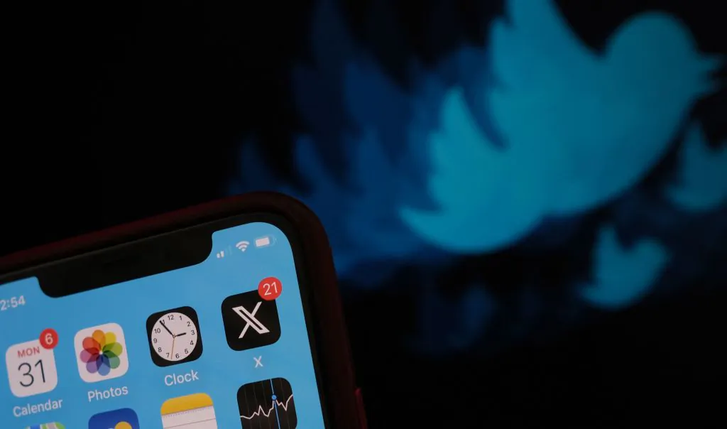 This photo illustration shows the X logo (formerly Twitter) on a smartphone screen in Los Angeles, California, on July 31, 2023. (Photo by Chris Delmas / AFP) (Photo by CHRIS DELMAS/AFP via Getty Images)
