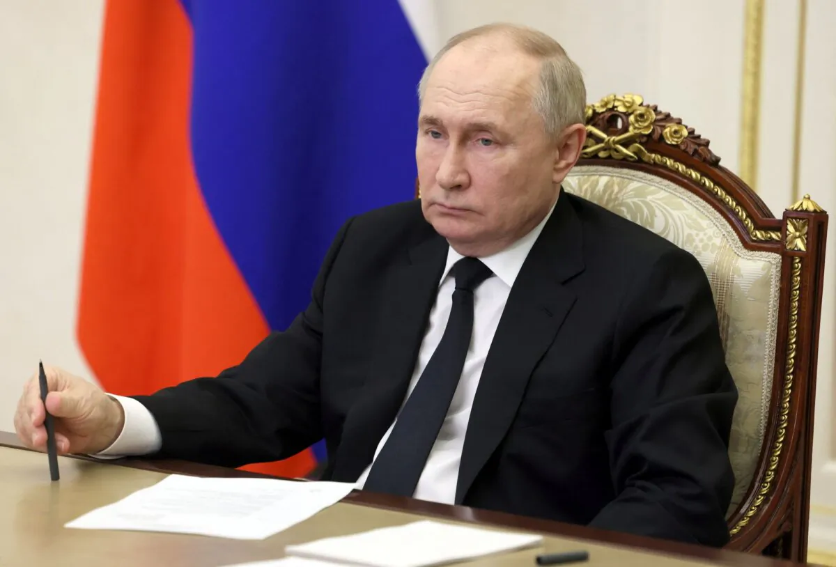 Russia's President Vladimir Putin holds a meeting on measures taken after a massacre in the Crocus City Hall via a videoconference at the Novo-Ogaryovo state residence, outside Moscow on March 25, 2024. (Mikhail Metzel/Pool/AFP via Getty Images)
