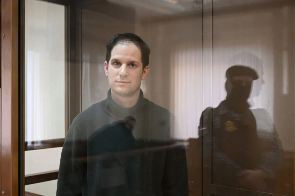 US journalist Evan Gershkovich stands inside a defendants' cage before a hearing to consider an appeal on his extended pre-trial detention, at the Moscow City Court in Moscow on Feb. 20, 2024. (Natalia Kolesnikova/AFP via Getty Images)
