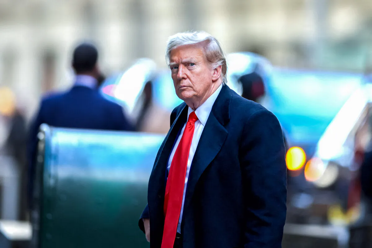 Trump arrives at 40 Wall Street after his court hearing to determine the date of his trial for allegedly covering up hush money payments linked to extramarital affairs, in New York City on March 25, 2024. (Charly Triballeau/AFP via Getty Images)
